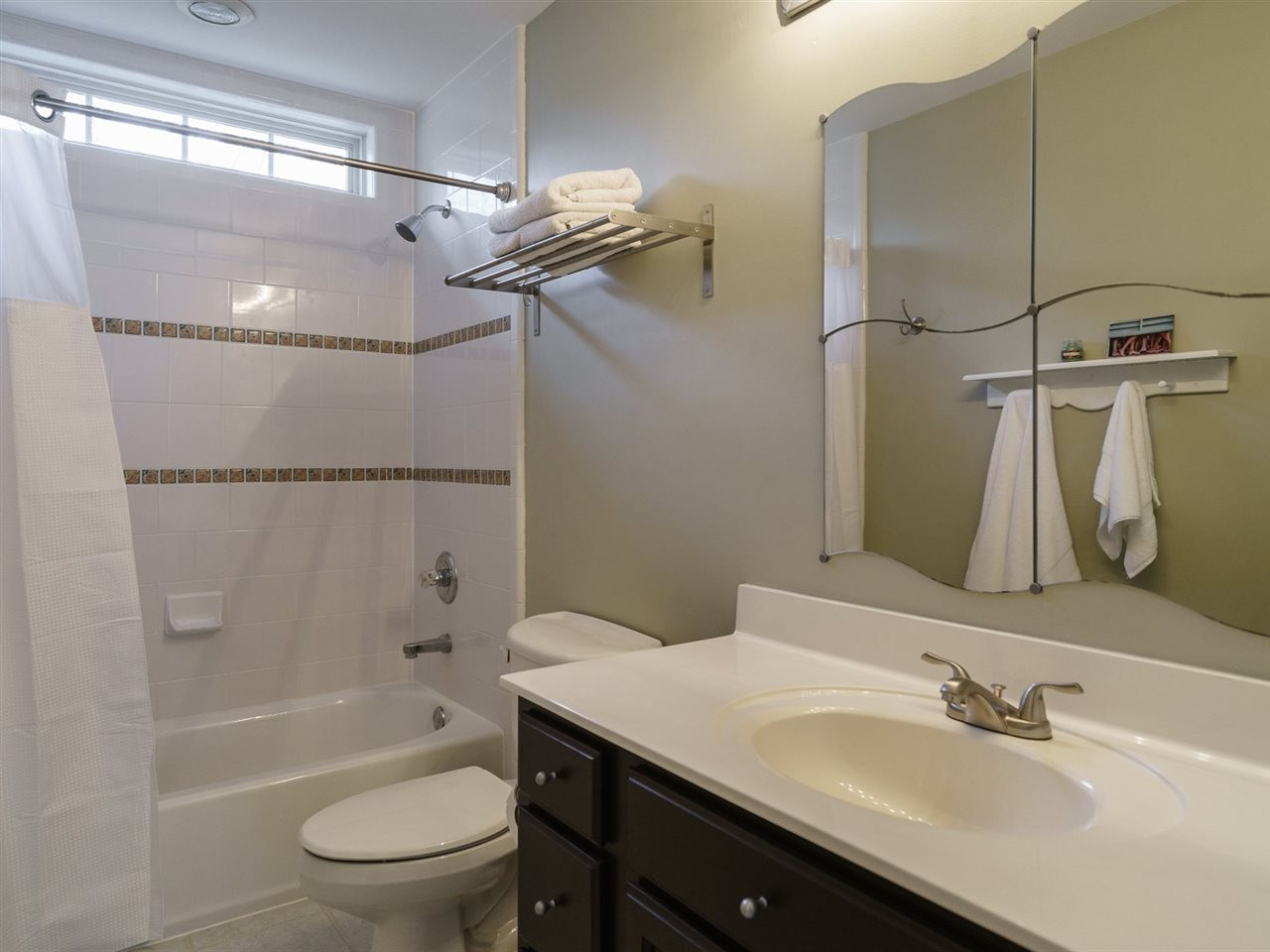 1105 Patterson Grove Road Apex, NC 27502 - Photo 16 of 25 The hall bath is perfect for sharing. It has tub/shower combination as well as tile floors. Bathroom