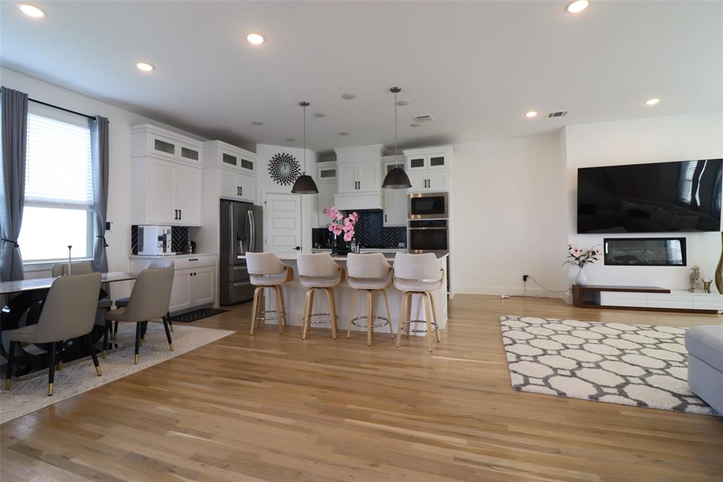 1205 Marc Place Rowlett, TX 75088 - Photo 12 of 30 a living room with furniture and a flat screen tv