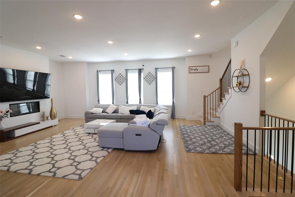 1205 Marc Place Rowlett, TX 75088 - Photo 13 of 30 a living room with furniture and a flat screen tv