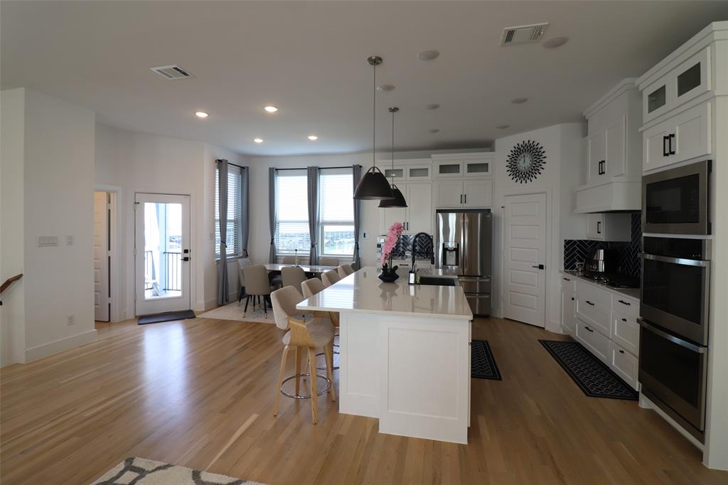 1205 Marc Place Rowlett, TX 75088 - Photo 15 of 30 a view of a dining room with furniture window and wooden floor