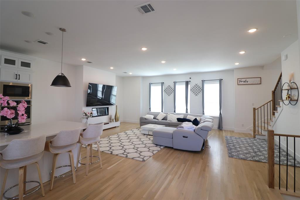 1205 Marc Place Rowlett, TX 75088 - Photo 20 of 30 a living room with furniture and a flat screen tv