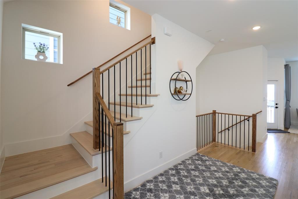 1205 Marc Place Rowlett, TX 75088 - Photo 21 of 30 a view of entryway with stairs and wooden floor