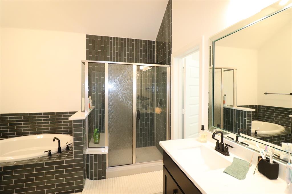 1205 Marc Place Rowlett, TX 75088 - Photo 25 of 30 a bathroom with a sink and a mirror