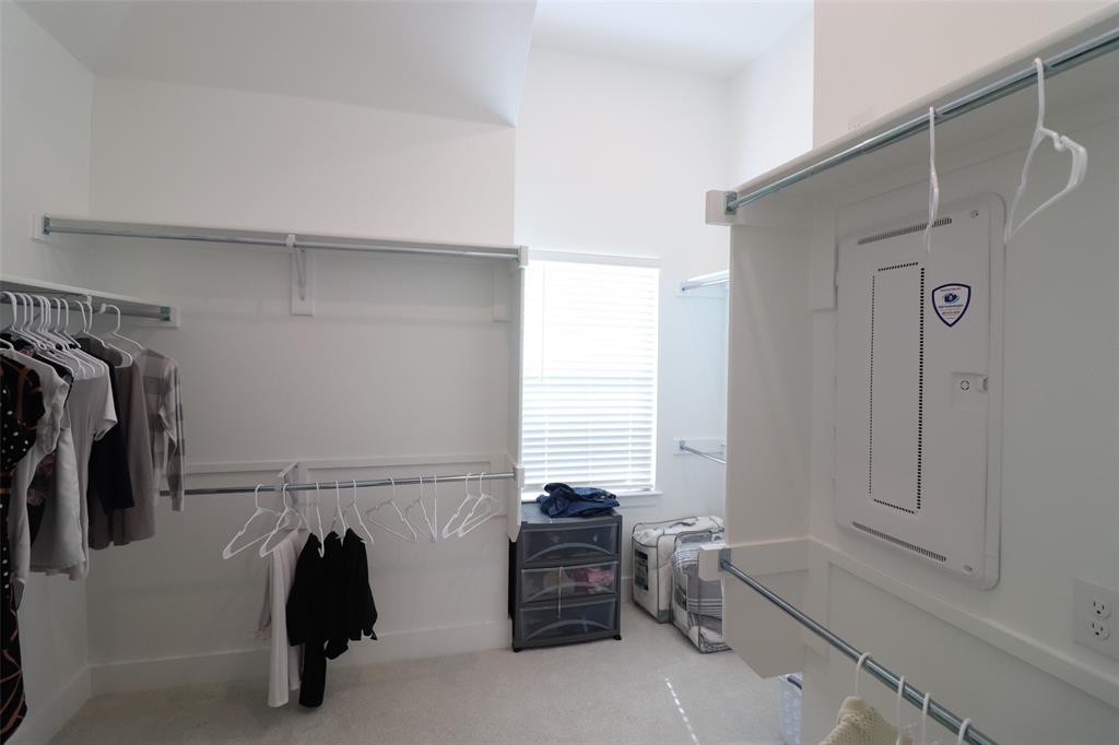 1205 Marc Place Rowlett, TX 75088 - Photo 26 of 30 a view of walk in closet with clothes and shoes