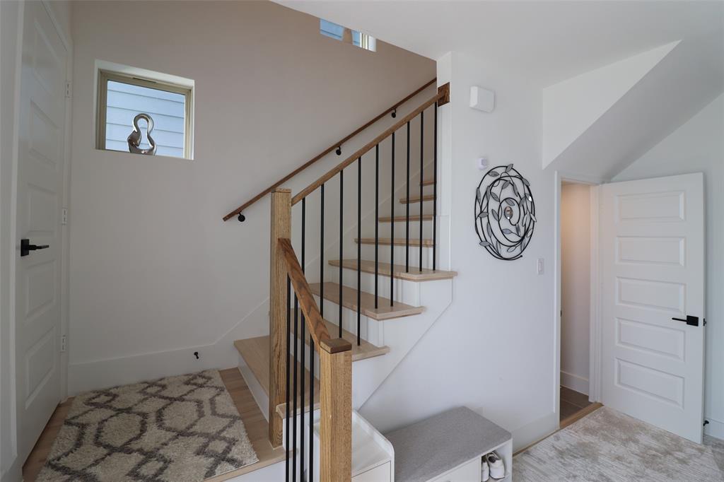1205 Marc Place Rowlett, TX 75088 - Photo 3 of 30 a view of entryway with stairs and wooden floor