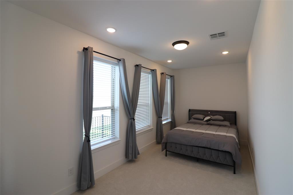 1205 Marc Place Rowlett, TX 75088 - Photo 6 of 30 a bedroom with furniture and a window