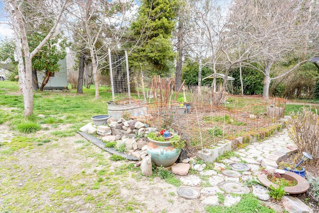 8587 Wagner Creek Road Talent, OR 97540 - Photo 28 of 35 Front flower garden