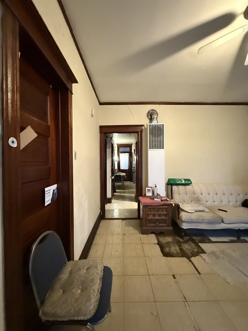 2847 South Harding Avenue Chicago, IL 60623 - Photo 3 of 12 a living room with furniture and a rug