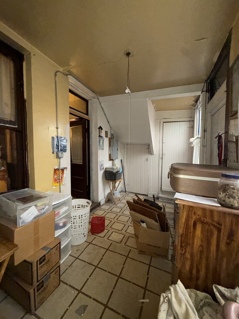 2847 South Harding Avenue Chicago, IL 60623 - Photo 9 of 12 a kitchen with stainless steel appliances granite countertop a sink stove and refrigerator