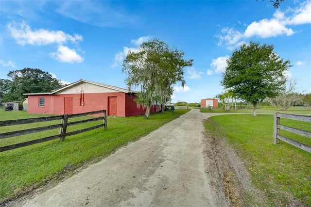a view of a big yard next to a house