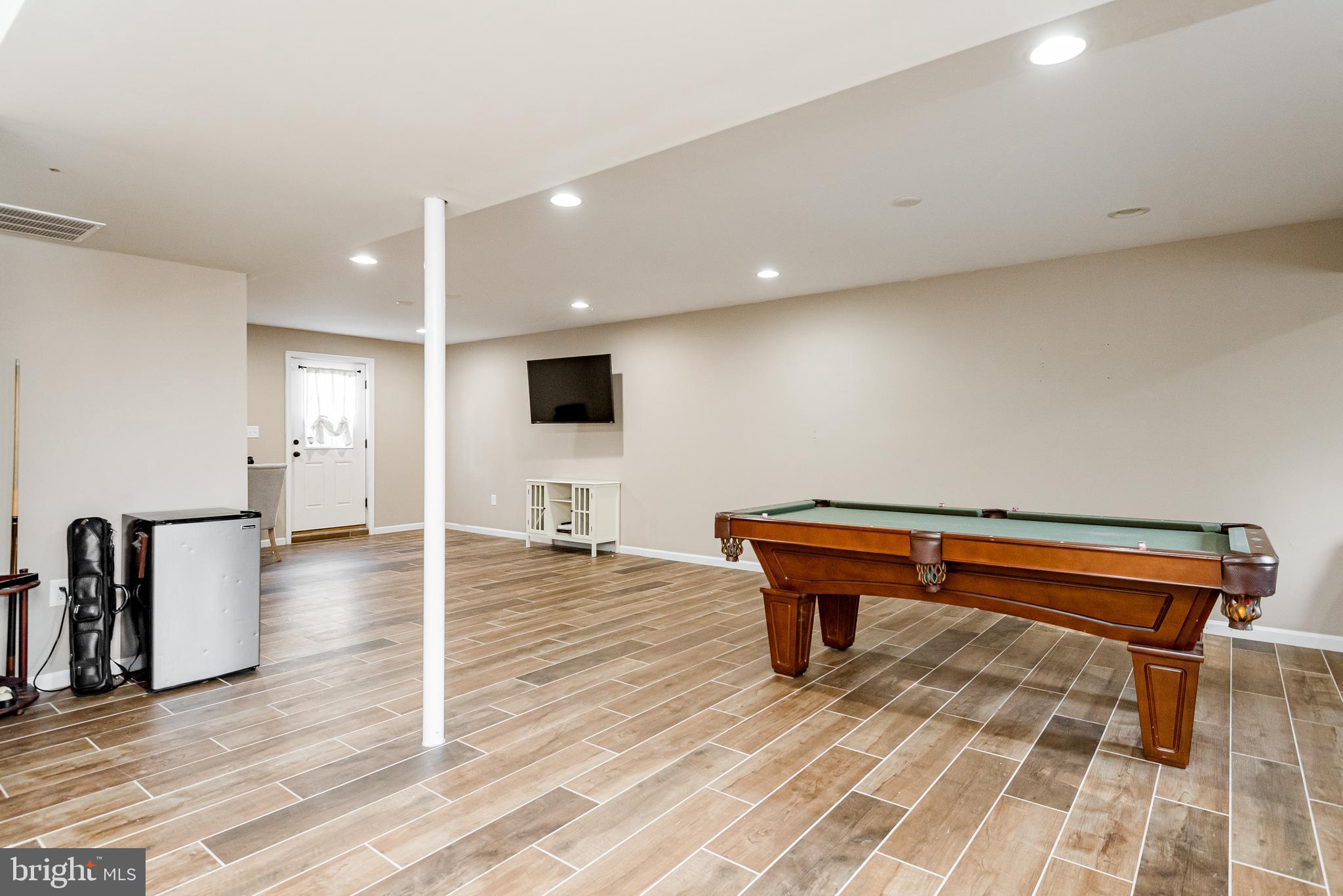 7827 East Shore Road Pasadena, MD 21122 - Photo 25 of 36 FAMILY ROOM HAS ROUGH IN FOR BATH