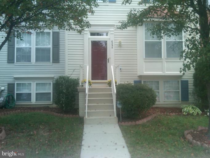 6394 Stagg Court Springfield, VA 22150 - Photo 5 of 10 a view of a house with a yard