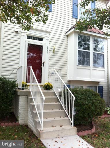 6394 Stagg Court Springfield, VA 22150 - Photo 10 of 10 a view of a house with large windows and stairs