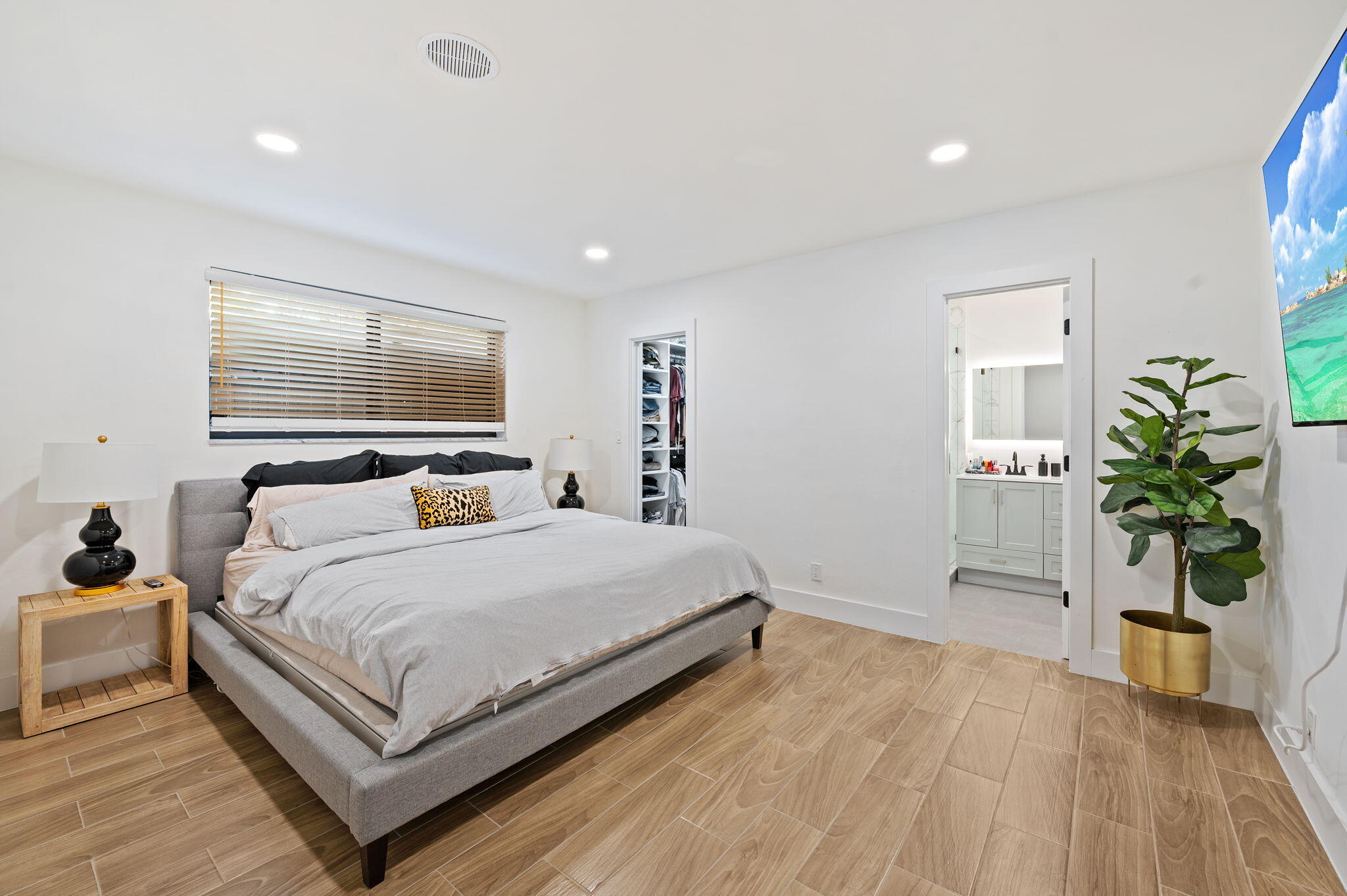 5420 Johnson Street Hollywood, FL 33021 - Photo 11 of 26 a bedroom with a bed and a potted plant