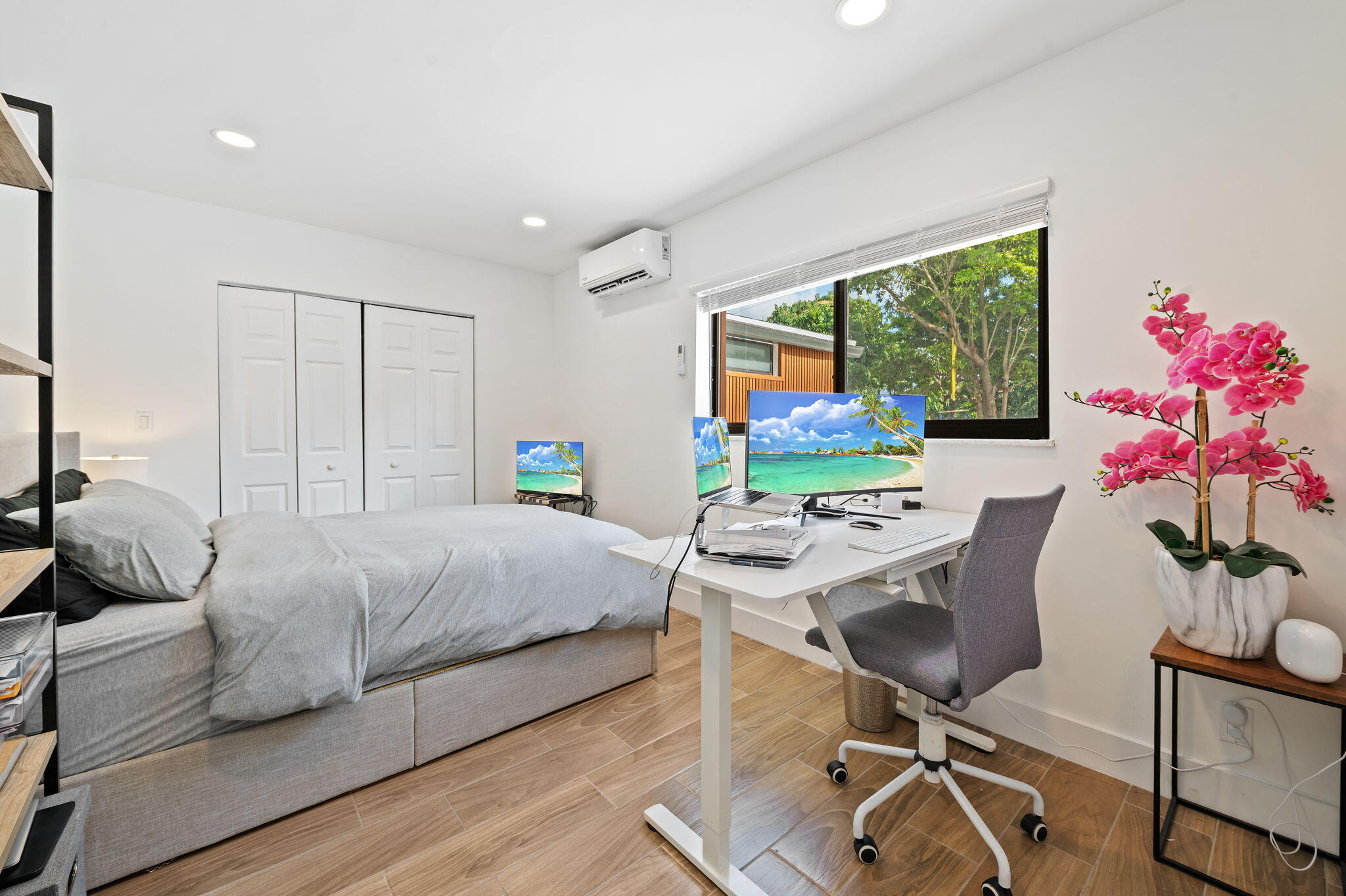 5420 Johnson Street Hollywood, FL 33021 - Photo 19 of 26 a bedroom with a bed and a desk
