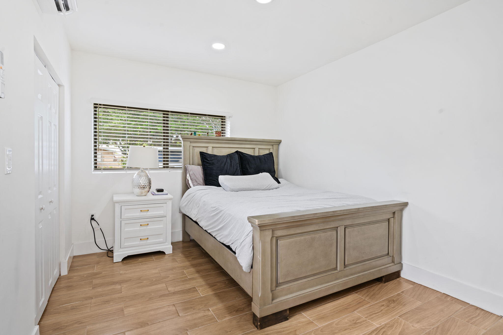 5420 Johnson Street Hollywood, FL 33021 - Photo 25 of 26 a bedroom with a bed and cabinets