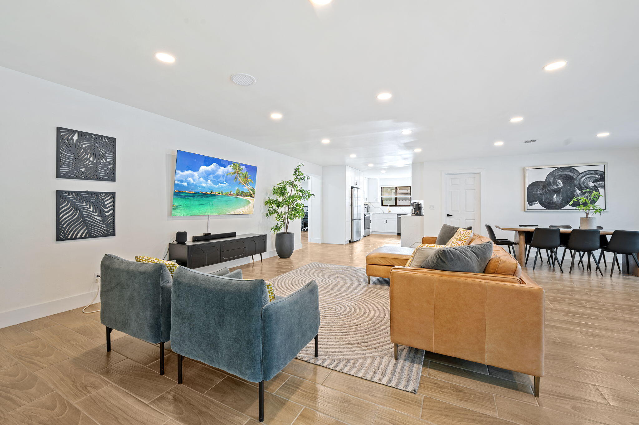 5420 Johnson Street Hollywood, FL 33021 - Photo 3 of 26 a living room with furniture and a flat screen tv