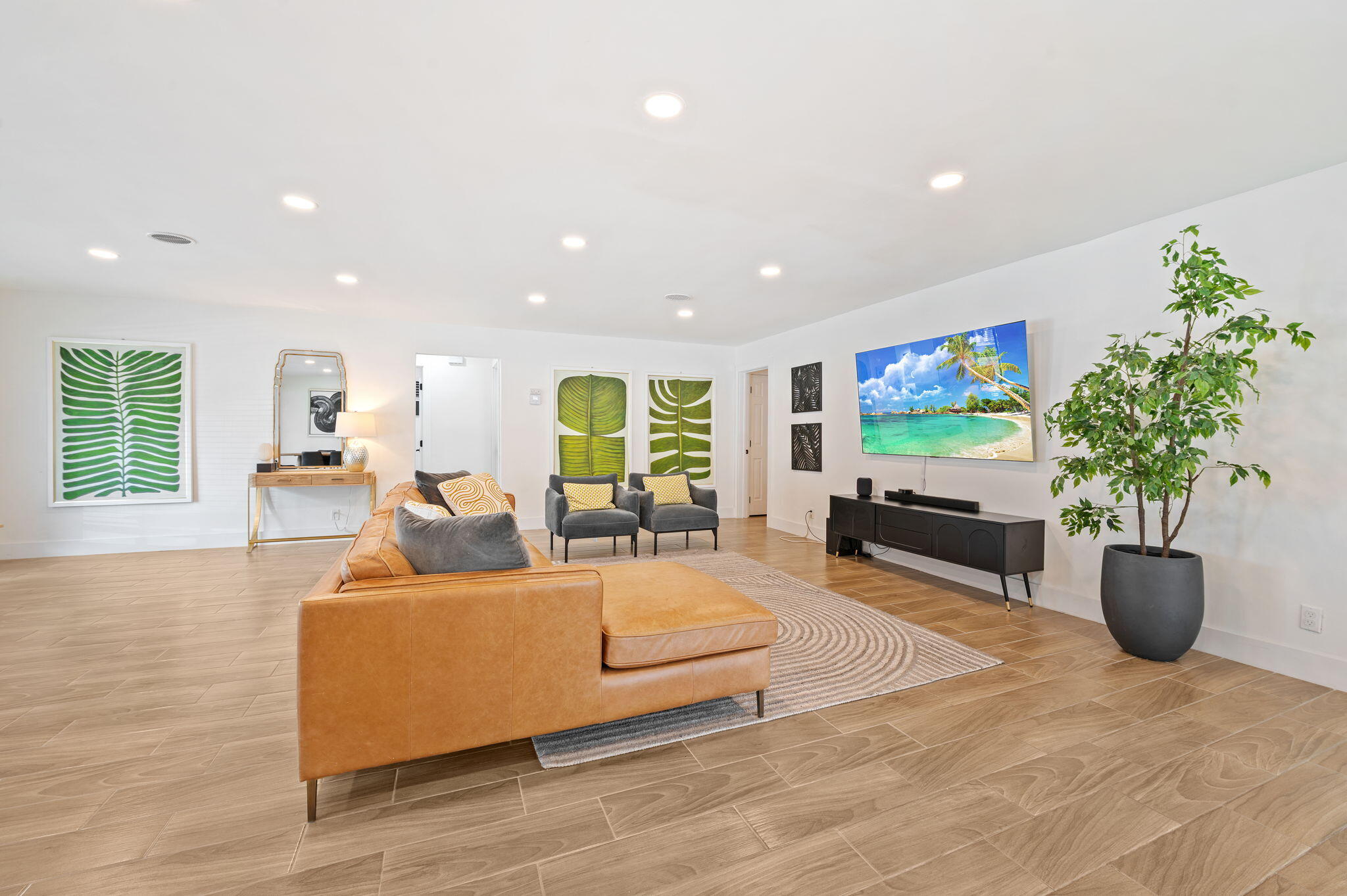 5420 Johnson Street Hollywood, FL 33021 - Photo 4 of 26 a living room with furniture potted plant and a flat screen tv