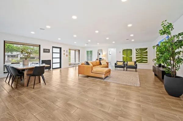 a living room with furniture and a potted plant
