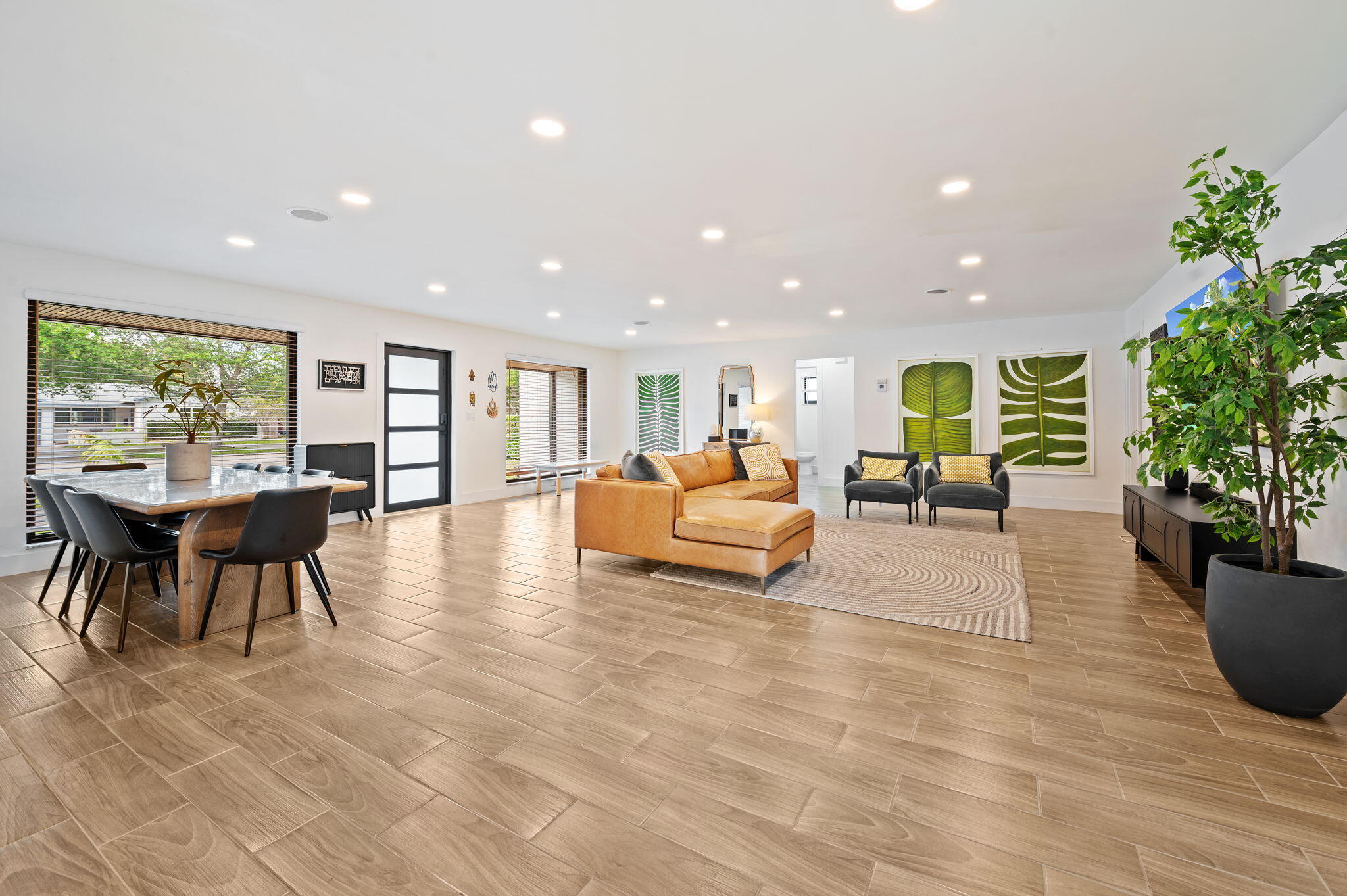 5420 Johnson Street Hollywood, FL 33021 - Photo 5 of 26 a living room with furniture and a potted plant