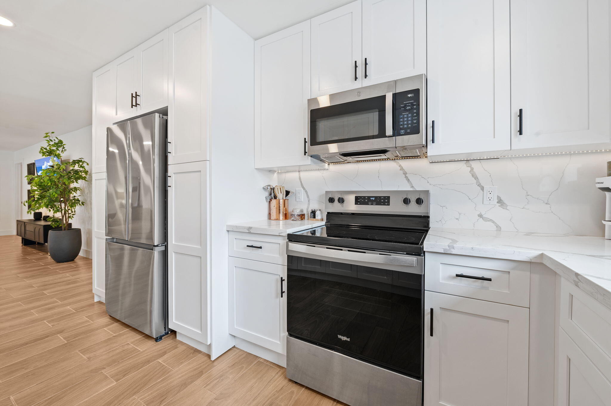 5420 Johnson Street Hollywood, FL 33021 - Photo 9 of 26 a kitchen with a refrigerator stove and microwave