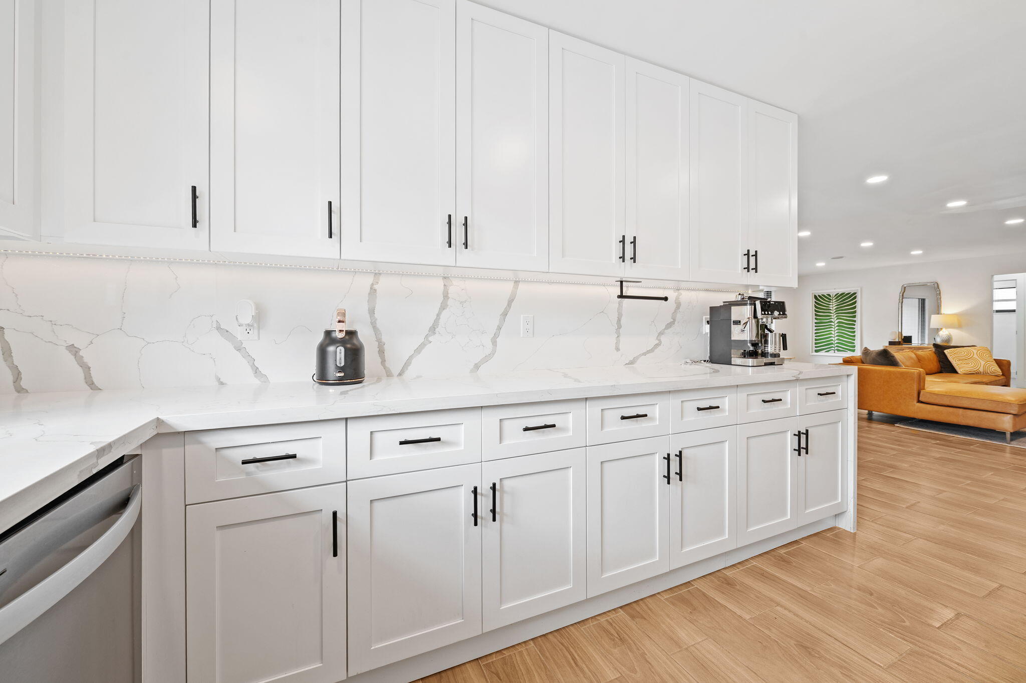 5420 Johnson Street Hollywood, FL 33021 - Photo 10 of 26 a kitchen with white cabinets and sink