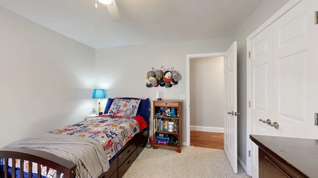 a bedroom with a bed and a dresser