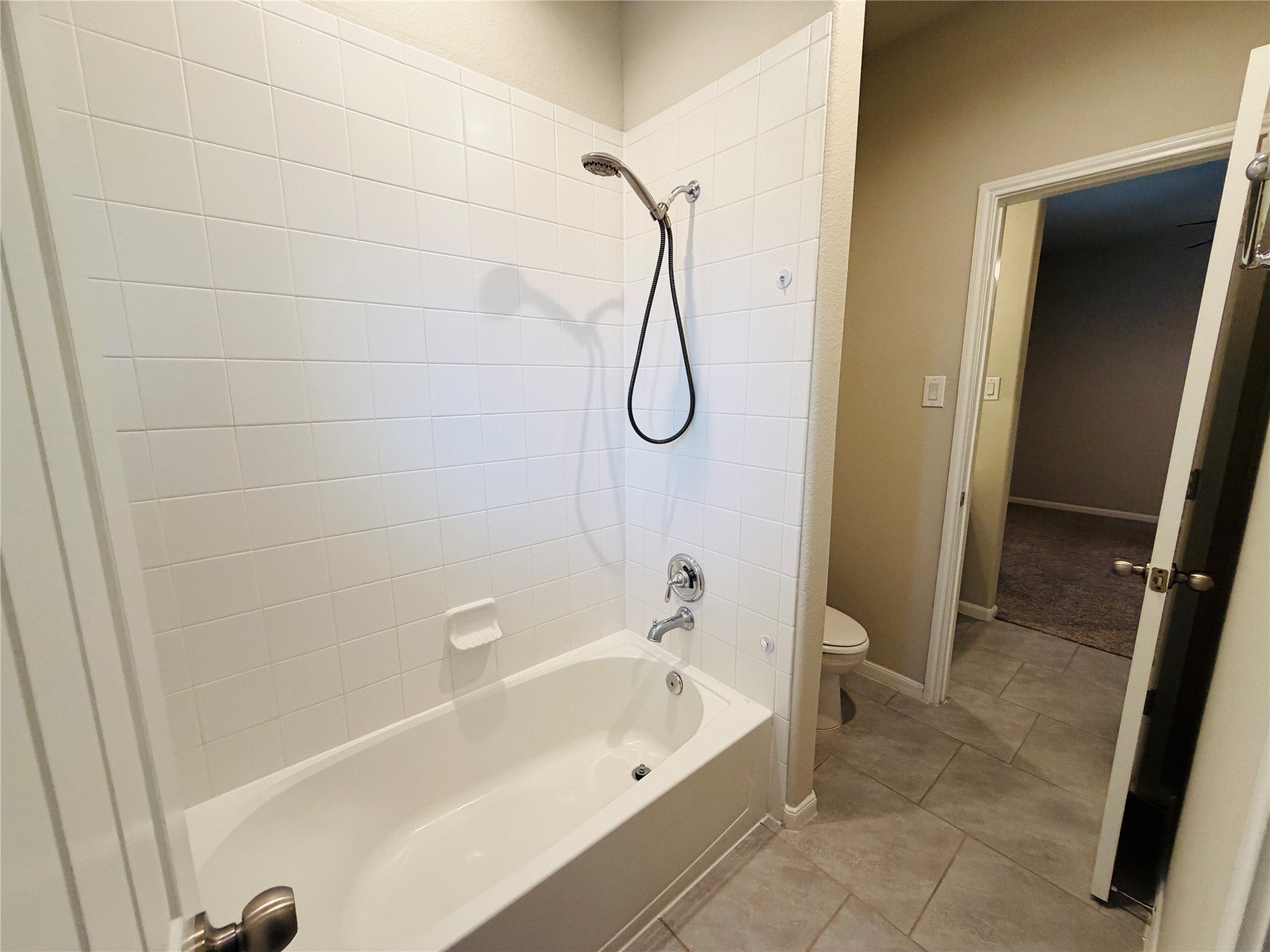 3318 Rainflower Springs Lane Rosenberg, TX 77471 - Photo 13 of 19 a bathroom with a bathtub and a shower