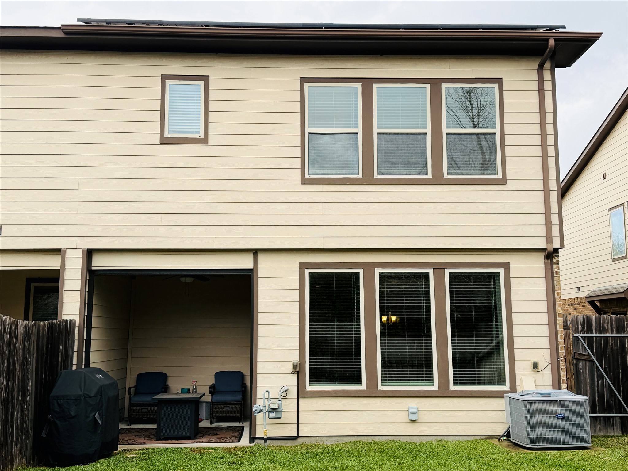 3318 Rainflower Springs Lane Rosenberg, TX 77471 - Photo 17 of 19 a view of a house with more windows and a yard