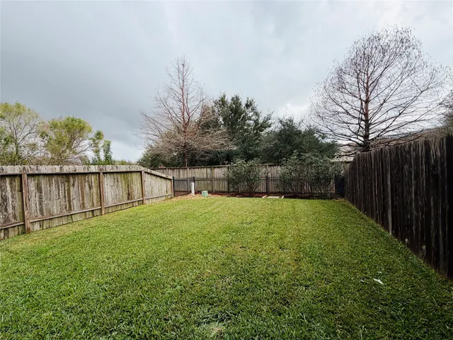 a view of backyard with green space