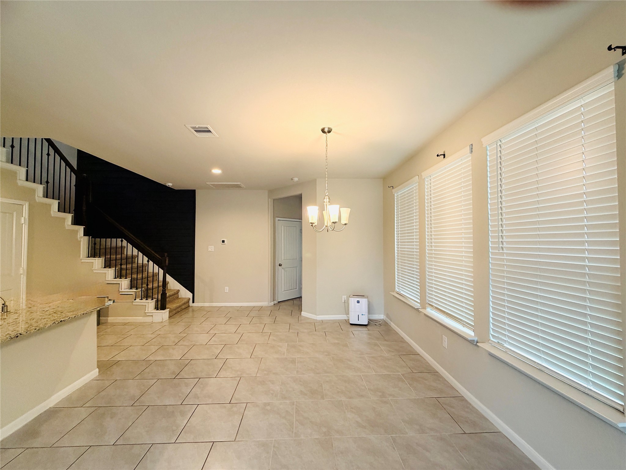 3318 Rainflower Springs Lane Rosenberg, TX 77471 - Photo 6 of 19 a view of an empty room with stairs