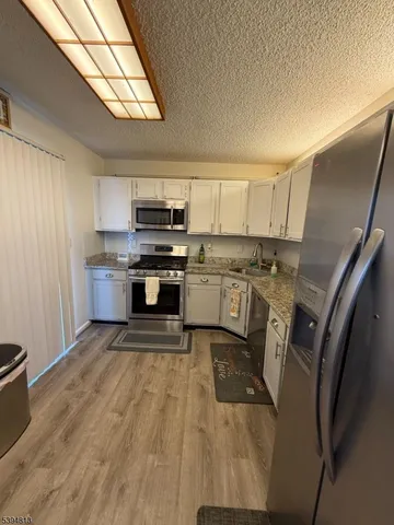 a view of deck with wooden floor and seating space