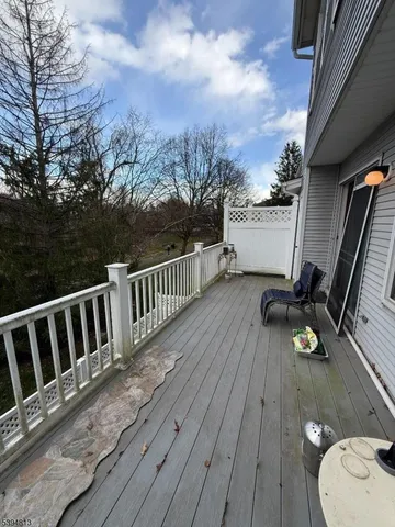 a view of room with window and wooden floor