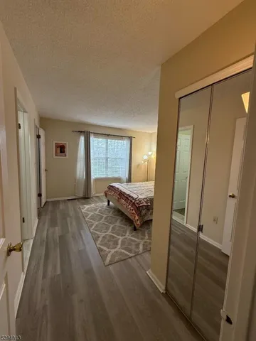 a bedroom with a bed and a table