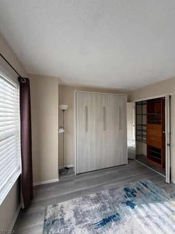 a backyard of a house with barbeque oven and outdoor seating