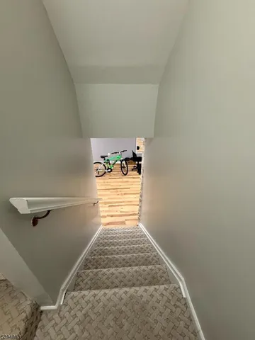 a view of a house with swimming pool and sitting area