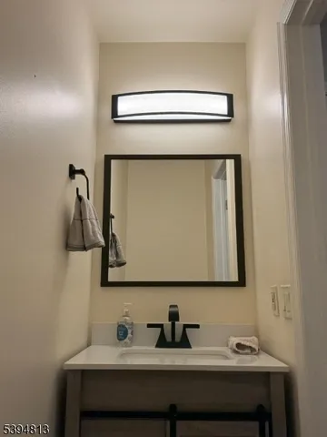 a bathroom with a sink and mirror
