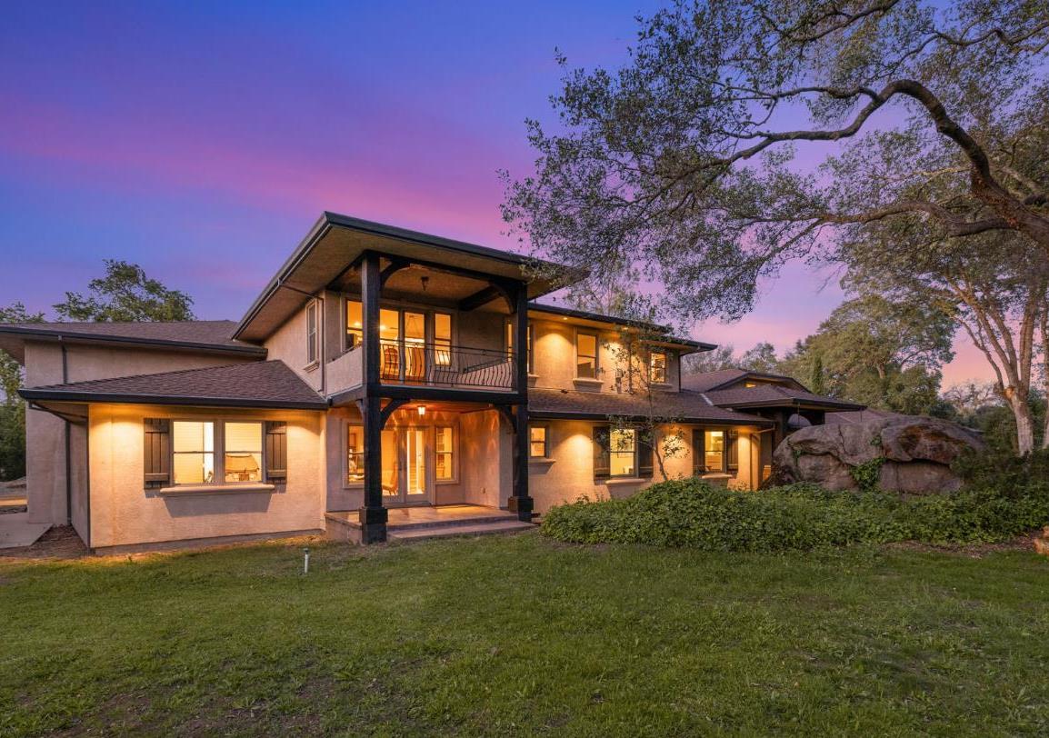 7021 Horseshoe Bar Road Loomis, CA 95650 - Photo 4 of 74 a front view of a house with a garden