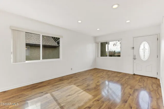 a view of kitchen with cabinets and wooden floor