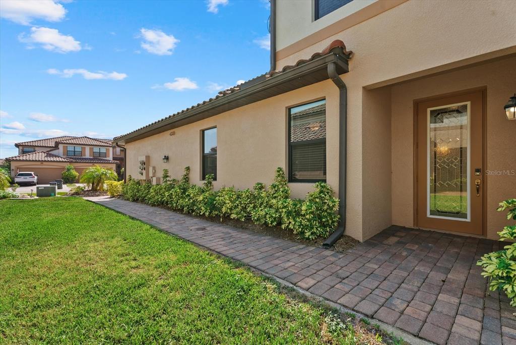 20080 Ragazza Circle, Unit 102 Venice, FL 34293 - Photo 35 of 49 a front view of a house with garden