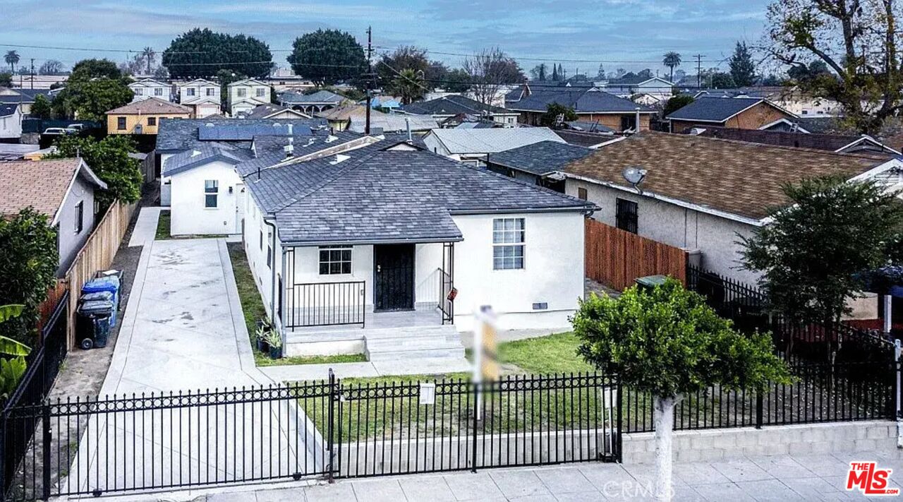 an aerial view of a house with a patio