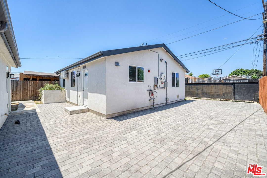 1947 East 114th Street, Unit 1947 1/2 Los Angeles, CA 90059 - Photo 3 of 16 a view of house with backyard and sitting area