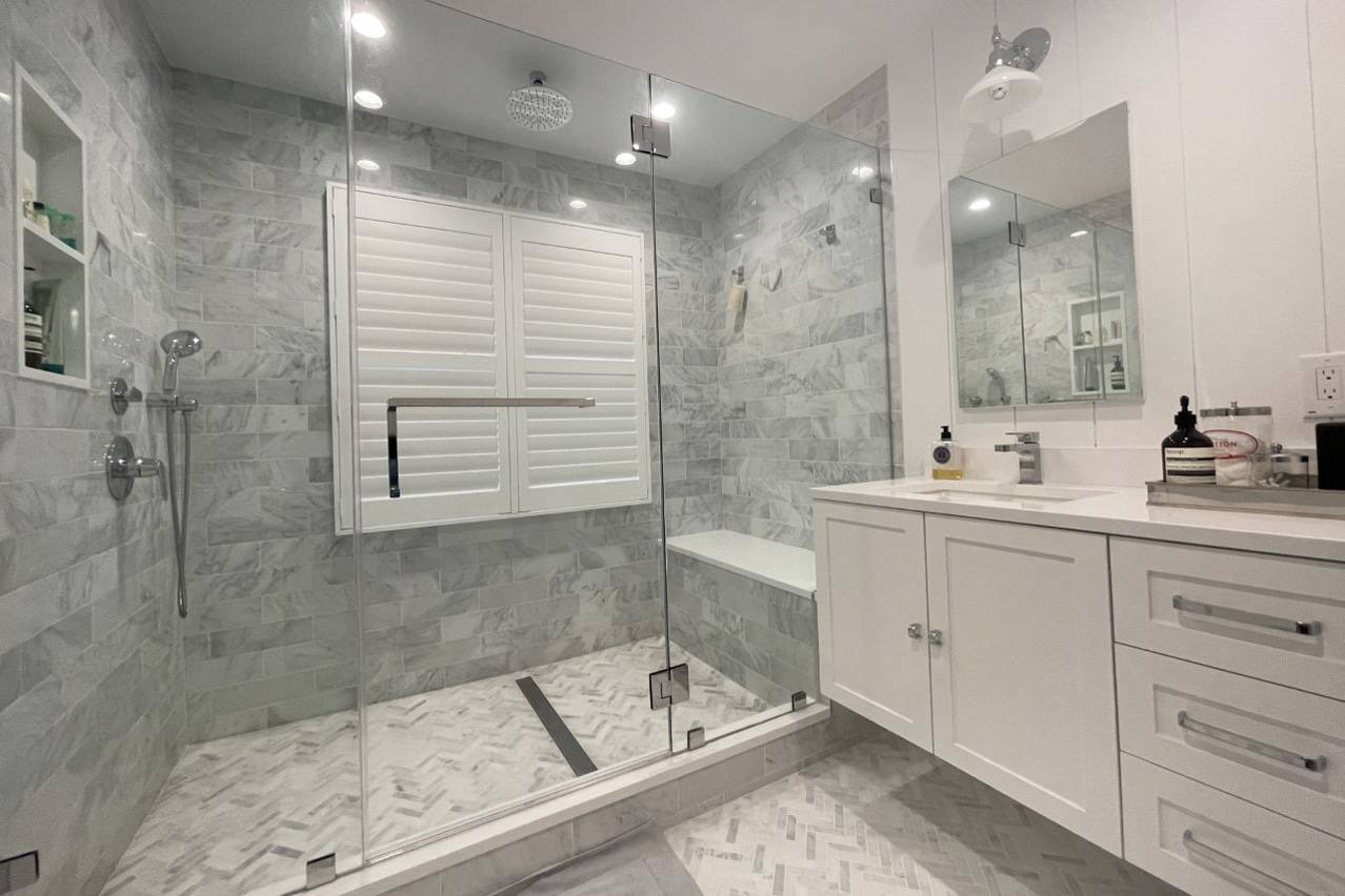 475 7 Ponds Towd Road Water Mill, NY 11976 - Photo 14 of 18 a bathroom with a double vanity sink mirror and shower