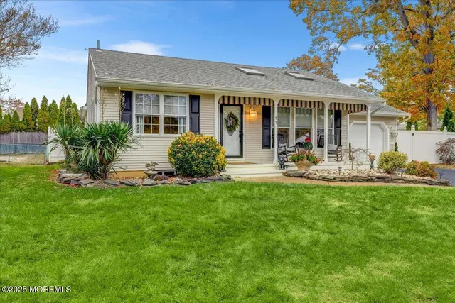a front view of a house with sitting space and garden