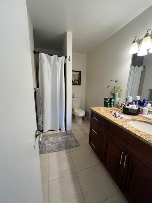 11750 Timbers Way Boca Raton, FL 33428 - Photo 12 of 25 a bathroom with a double vanity sink and a mirror