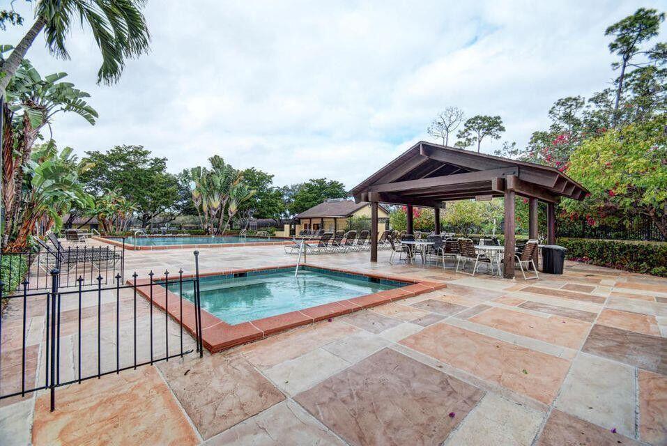 11750 Timbers Way Boca Raton, FL 33428 - Photo 14 of 25 a view of a swimming pool with sitting area and furniture
