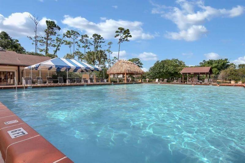 11750 Timbers Way Boca Raton, FL 33428 - Photo 15 of 25 a view of a house with a yard