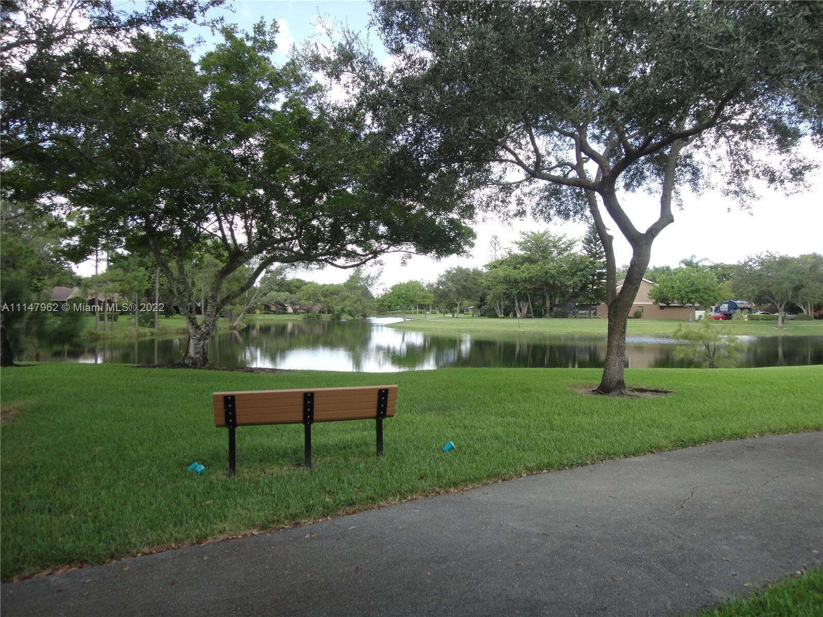 11750 Timbers Way Boca Raton, FL 33428 - Photo 18 of 25 a view of a bench in a park