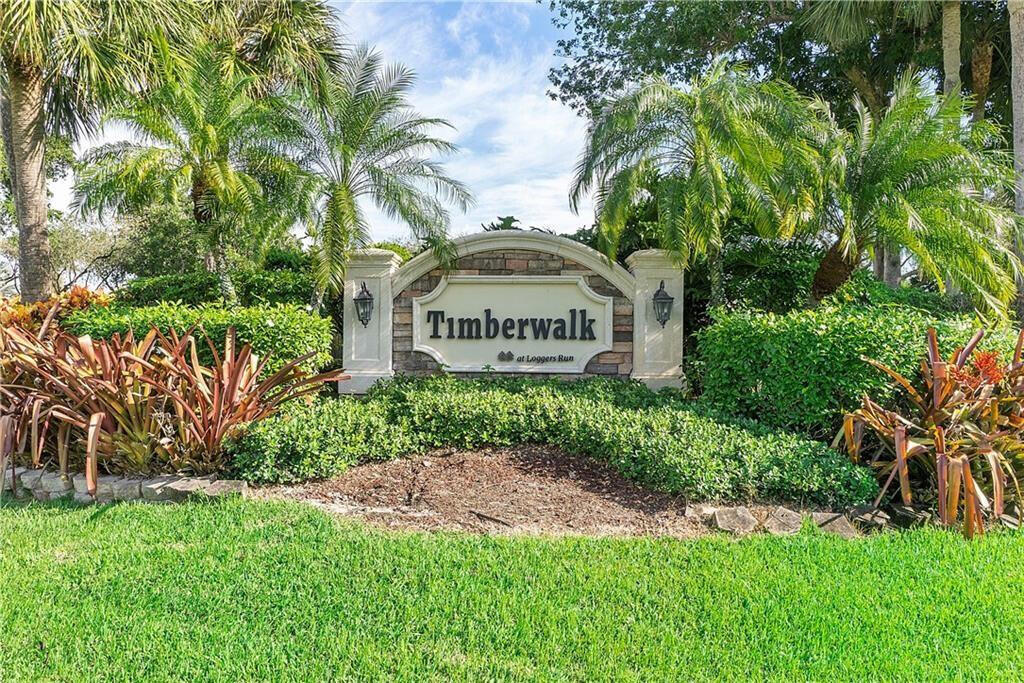 11750 Timbers Way Boca Raton, FL 33428 - Photo 23 of 25 a sign on the side of the grass