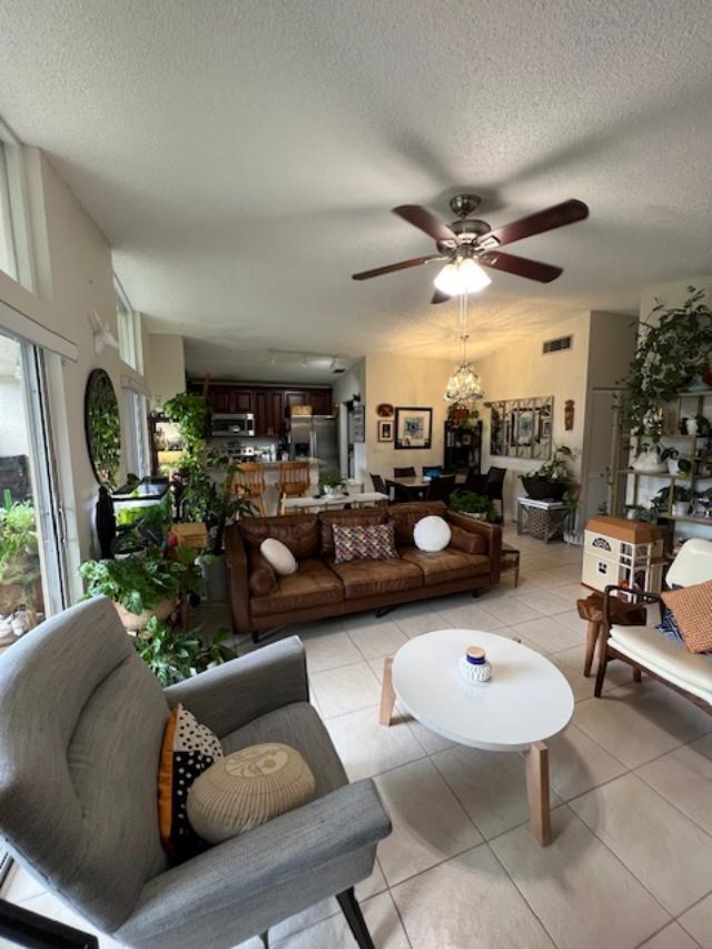 11750 Timbers Way Boca Raton, FL 33428 - Photo 6 of 25 a living room with furniture and a large window